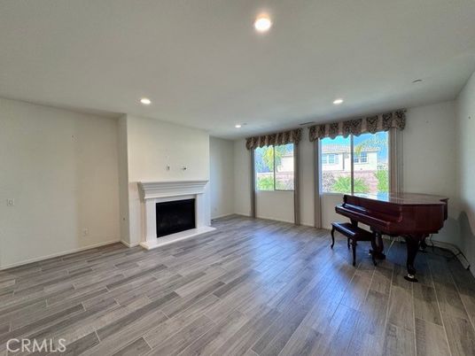 Empty room, Fireplace, Interior, Piano, Recessed Lighting, Wood Texture Flooring