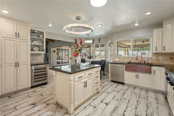 Chandelier, Dining room, Interior, Kitchen, Pendant Lights, Recessed Lighting, Stainless Steel Appliances, Wood Texture Flooring