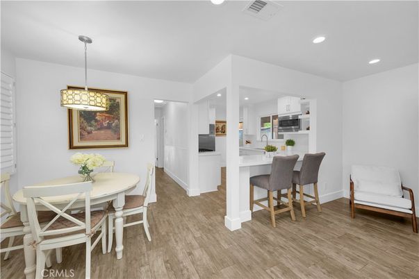 Dining room, Interior, Kitchen, Pendant Lights, Recessed Lighting, Stainless Steel Appliances, Wood Texture Flooring