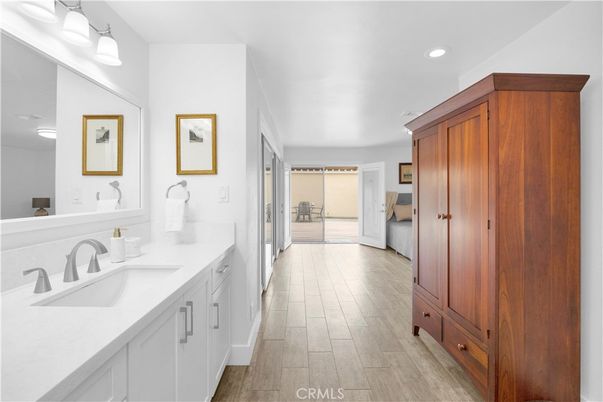 Bathroom, Dual Sink Vanities, Interior, Recessed Lighting, Wood Texture Flooring