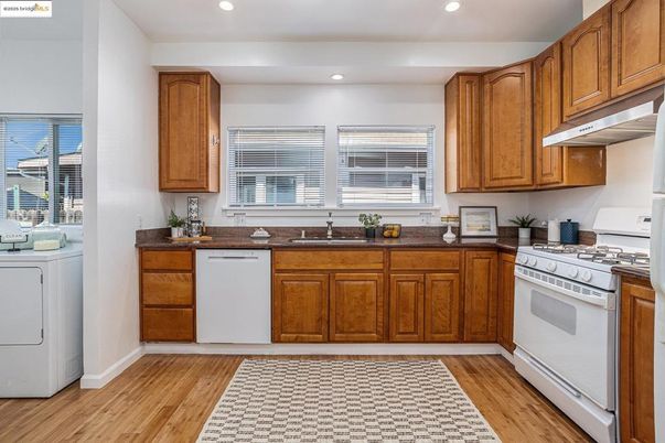Interior, Kitchen, Recessed Lighting, Washer, Wood Texture Flooring