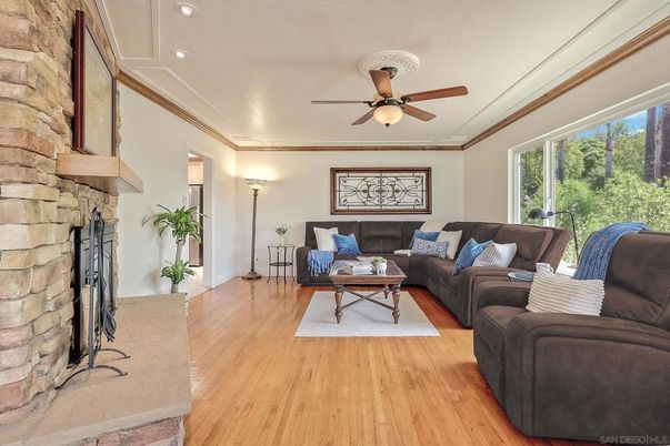 Fireplace, Interior, Living room, Recessed Lighting, Stone Walls, Wood Texture Flooring