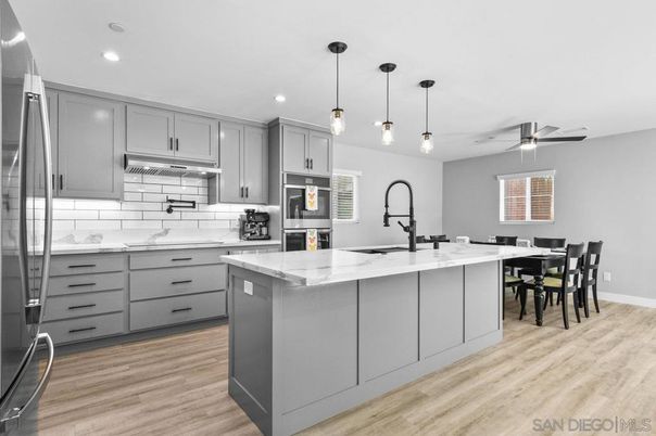 Dining room, Interior, Kitchen, Pendant Lights, Recessed Lighting, Stainless Steel Appliances, Wood Texture Flooring