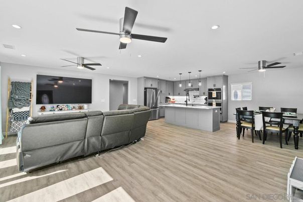 Dining room, Interior, Kitchen, Living room, Pendant Lights, Recessed Lighting, Stainless Steel Appliances, Wood Texture Flooring