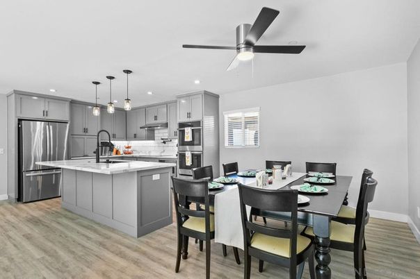Dining room, Interior, Kitchen, Pendant Lights, Recessed Lighting, Stainless Steel Appliances, Wood Texture Flooring