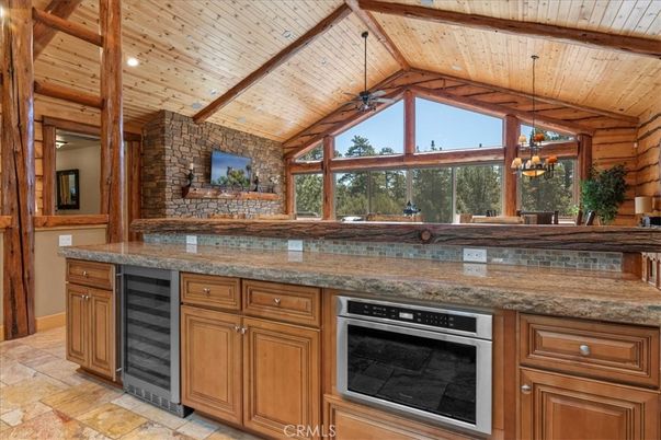 Chandelier, Interior, Kitchen, Pendant Lights, Recessed Lighting, Stainless Steel Appliances, Stone Walls, Wooden Beams, Wooden Ceilings