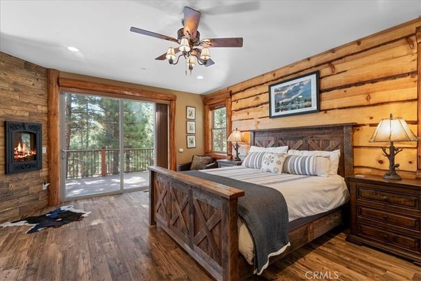 Bedroom, Fireplace, Interior, Recessed Lighting, Wood Texture Flooring, Wooden Walls