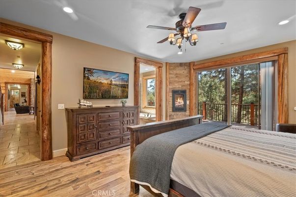Bedroom, Fireplace, Interior, Recessed Lighting, Wood Texture Flooring