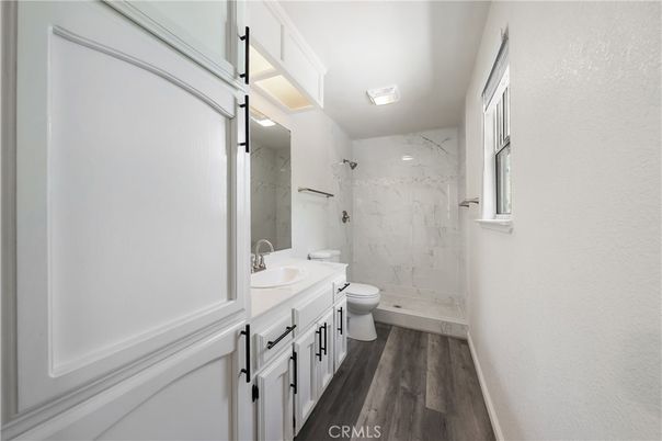 Bathroom, Glass Shower, Interior, Marble Walls, Wood Texture Flooring