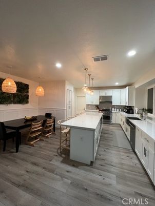 Dining room, Interior, Kitchen, Pendant Lights, Recessed Lighting, Stainless Steel Appliances, Wood Texture Flooring