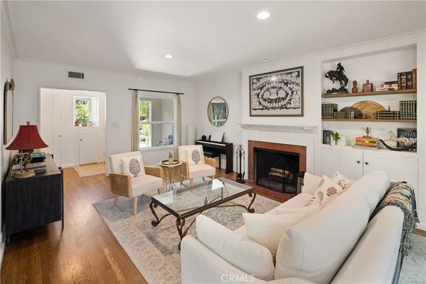 Fireplace, Interior, Living room, Piano, Recessed Lighting, Wood Texture Flooring