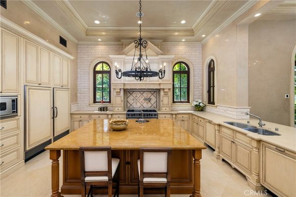 Chandelier, Interior, Kitchen, Pendant Lights, Recessed Lighting, Stainless Steel Appliances, Stone Walls