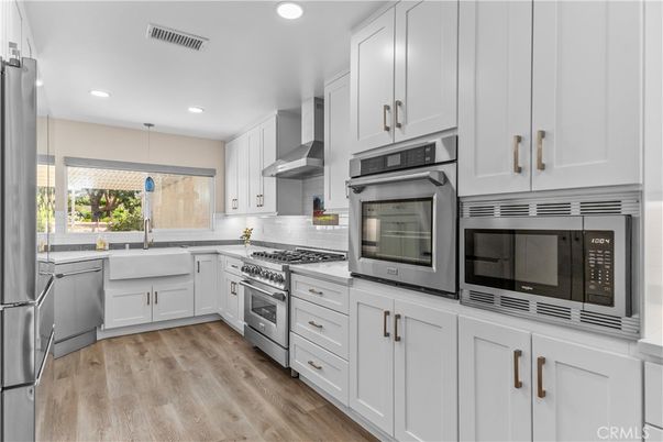 Interior, Kitchen, Recessed Lighting, Stainless Steel Appliances, Wood Texture Flooring
