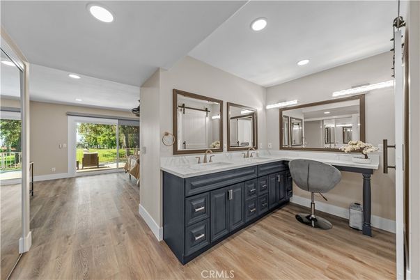Bathroom, Dual Sink Vanities, Interior, Recessed Lighting, Wood Texture Flooring