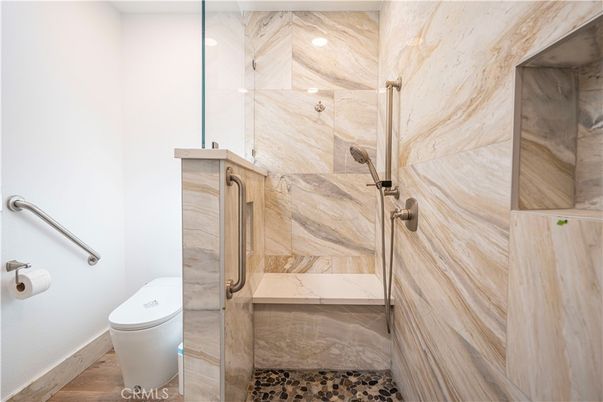 Bathroom, Glass Shower, Interior, Marble Walls, Recessed Lighting, Wood Texture Flooring