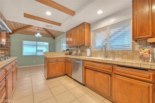 Interior, Kitchen, Pendant Lights, Recessed Lighting, Stainless Steel Appliances, Tile Countertops, Wooden Beams, Wooden Ceilings