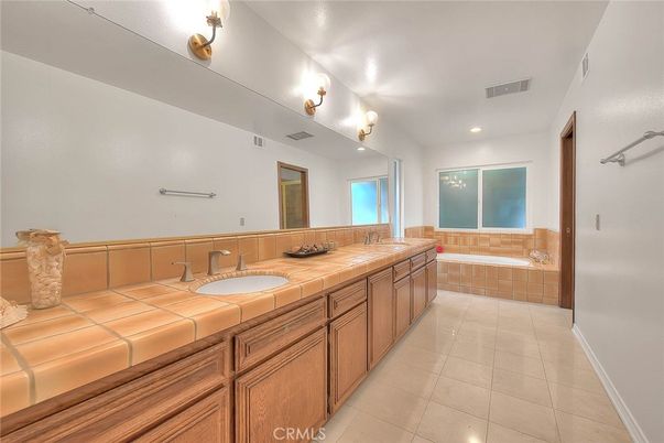 Bathroom, Dual Sink Vanities, Interior, Recessed Lighting, Tile Countertops