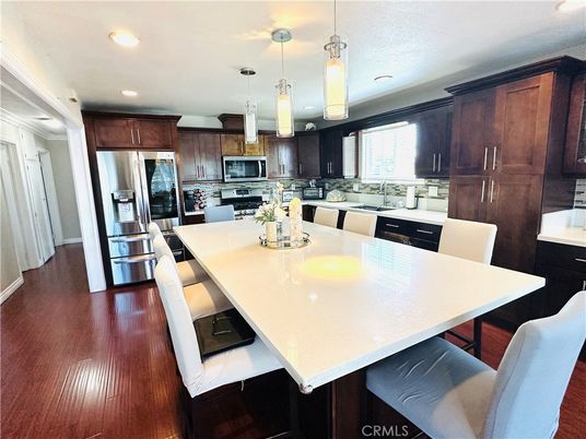 Dining room, Interior, Kitchen, Pendant Lights, Recessed Lighting, Stainless Steel Appliances, Wood Texture Flooring