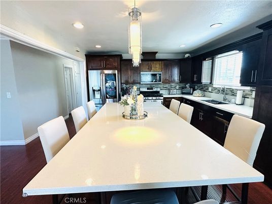 Dining room, Interior, Kitchen, Pendant Lights, Recessed Lighting, Stainless Steel Appliances, Wood Texture Flooring