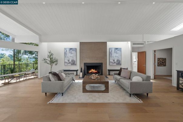 Fireplace, Interior, Living room, Recessed Lighting, Stone Walls, Wood Texture Flooring
