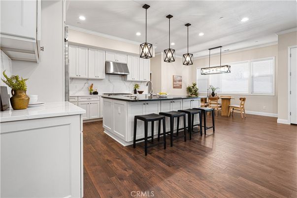 Dining room, Interior, Kitchen, Pendant Lights, Recessed Lighting, Stainless Steel Appliances, Wood Texture Flooring