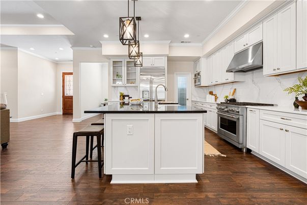 Interior, Kitchen, Marble Walls, Pendant Lights, Recessed Lighting, Stainless Steel Appliances, Wood Texture Flooring
