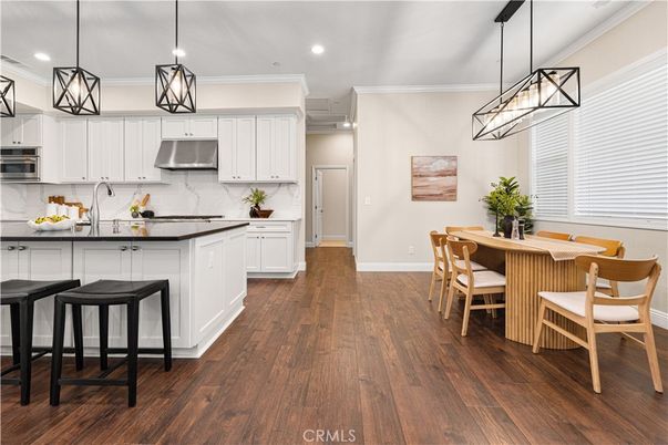 Dining room, Interior, Kitchen, Pendant Lights, Recessed Lighting, Stainless Steel Appliances, Wood Texture Flooring