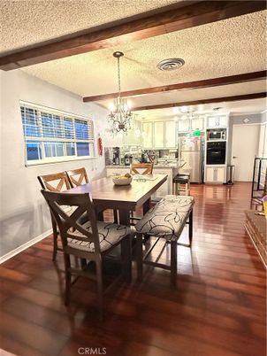 Chandelier, Dining room, Interior, Kitchen, Stainless Steel Appliances, Wood Texture Flooring