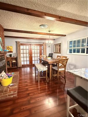 Chandelier, Dining room, Fireplace, Interior, Recessed Lighting, Wooden Beams, Wood Texture Flooring