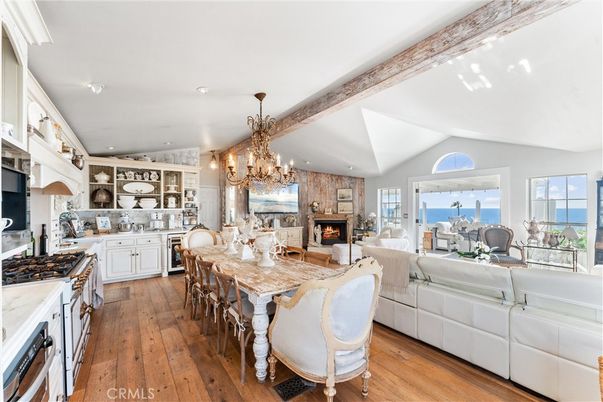 Chandelier, Dining room, Fireplace, Interior, Kitchen, Living room, Recessed Lighting, Water, Wooden Beams, Wood Texture Flooring