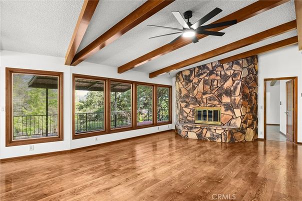 Empty room, Fireplace, Interior, Stone Walls, Wooden Beams, Wood Texture Flooring
