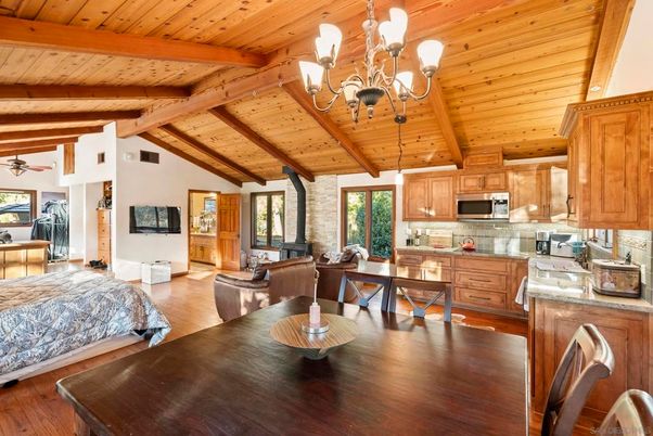 Chandelier, Dining room, Interior, Kitchen, Living room, Stainless Steel Appliances, Stone Walls, Wooden Beams, Wooden Ceilings, Wood Texture Flooring