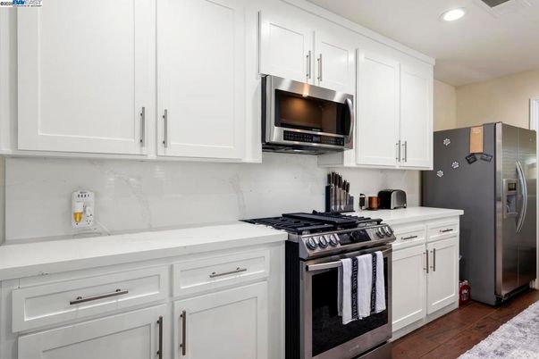 Interior, Kitchen, Recessed Lighting, Stainless Steel Appliances, Wood Texture Flooring