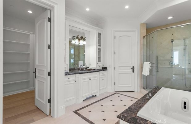 Bathroom, Dual Sink Vanities, Glass Shower, Interior, Recessed Lighting, Wood Texture Flooring