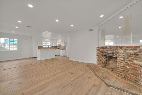 Empty room, Fireplace, Interior, Kitchen, Recessed Lighting, Wood Texture Flooring