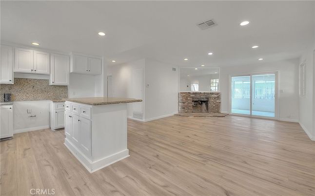 Empty room, Fireplace, Interior, Kitchen, Recessed Lighting, Wood Texture Flooring