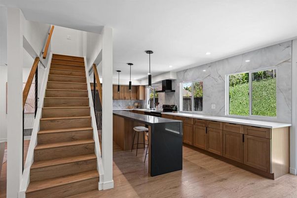 Interior, Kitchen, Marble Walls, Pendant Lights, Recessed Lighting, Stainless Steel Appliances, Wood Texture Flooring