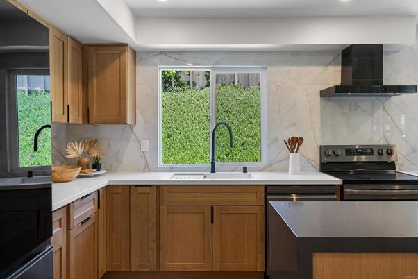 Interior, Kitchen, Marble Walls, Recessed Lighting, Stainless Steel Appliances