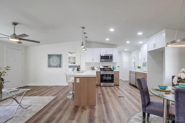 Dining room, Interior, Kitchen, Pendant Lights, Recessed Lighting, Stainless Steel Appliances, Wood Texture Flooring