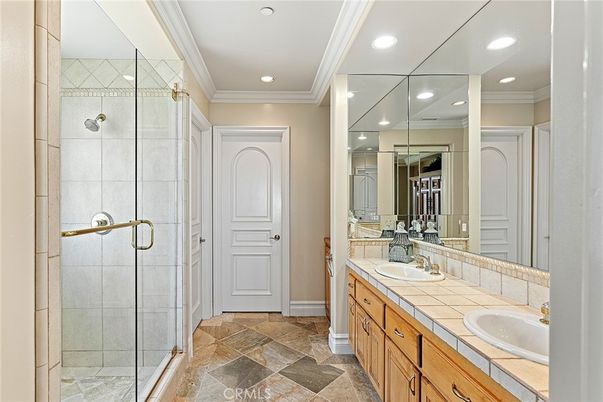 Bathroom, Dual Sink Vanities, Glass Shower, Interior, Recessed Lighting, Tile Countertops
