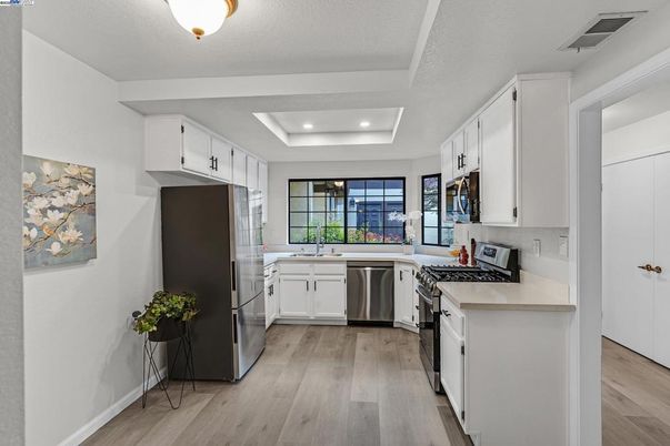 Interior, Kitchen, Recessed Lighting, Stainless Steel Appliances, Wood Texture Flooring