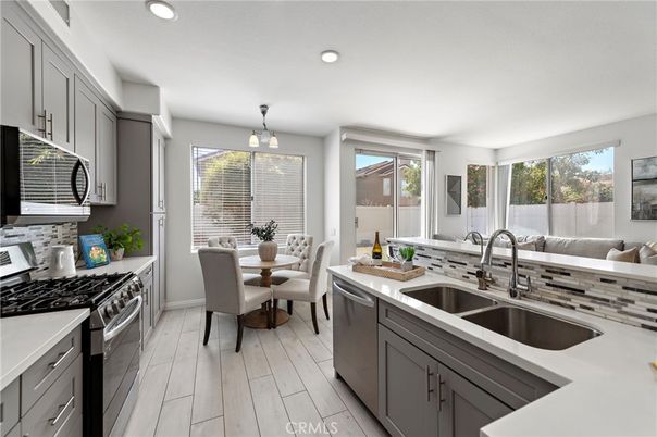 Dining room, Interior, Kitchen, Pendant Lights, Recessed Lighting, Stainless Steel Appliances, Wood Texture Flooring
