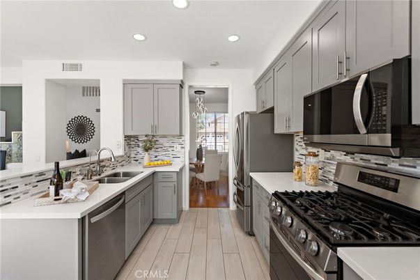 Dining room, Interior, Kitchen, Recessed Lighting, Stainless Steel Appliances, Wood Texture Flooring