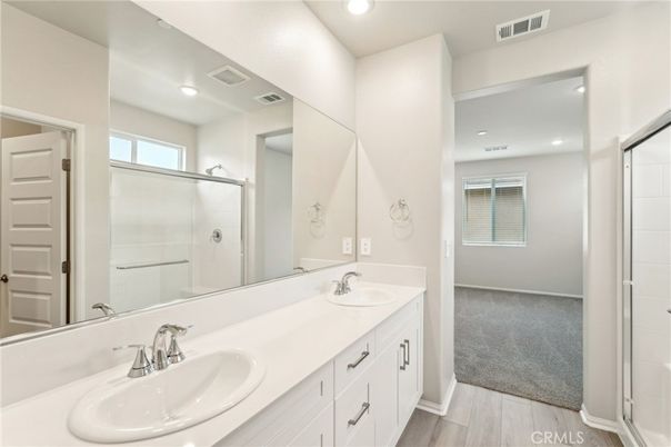 Bathroom, Dual Sink Vanities, Glass Shower, Interior, Recessed Lighting, Wood Texture Flooring