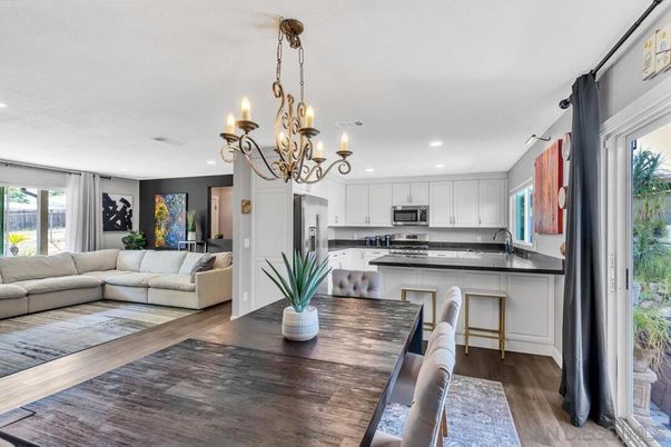 Chandelier, Dining room, Interior, Kitchen, Living room, Recessed Lighting, Stainless Steel Appliances, Wood Texture Flooring