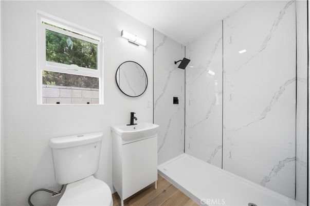 Bathroom, Dual Sink Vanities, Interior, Marble Walls, Wood Texture Flooring