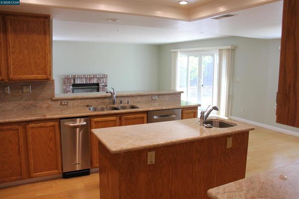 Fireplace, Interior, Kitchen, Recessed Lighting, Stainless Steel Appliances, Wood Texture Flooring