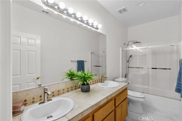 Bathroom, Dual Sink Vanities, Glass Shower, Interior, Marble, Recessed Lighting, Tile Countertops