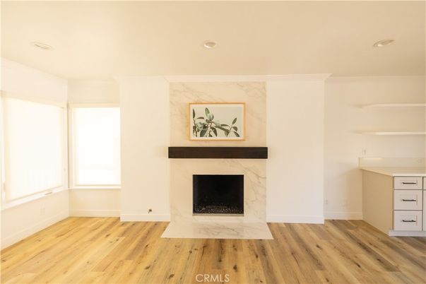Empty room, Fireplace, Interior, Marble Walls, Recessed Lighting, Wood Texture Flooring