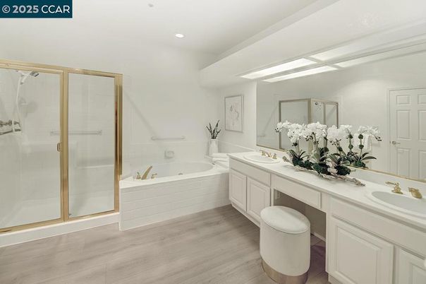 Bathroom, Dual Sink Vanities, Glass Shower, Interior, Recessed Lighting, Wood Texture Flooring